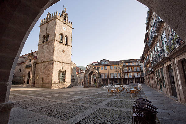 Historical city square of Guimaraes in Portugal, angle seen from an old archway